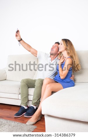 Man and woman making selfie with the phone