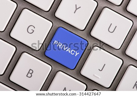 Privacy button on white computer keyboard 