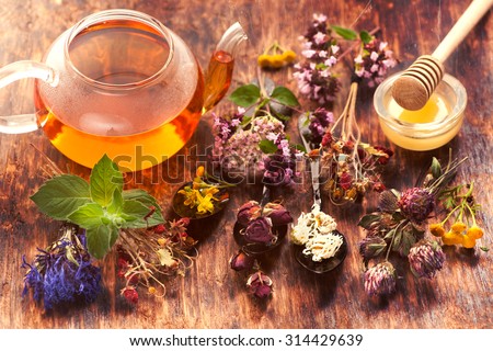 Herbal tea, herbs and flowers Royalty-Free Stock Photo #314429639