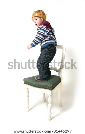 Child is king. toddler with crown isolated on white symbol for ruler