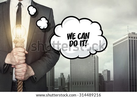 We can do it text on speech bubble with businessman holding lamp on city background