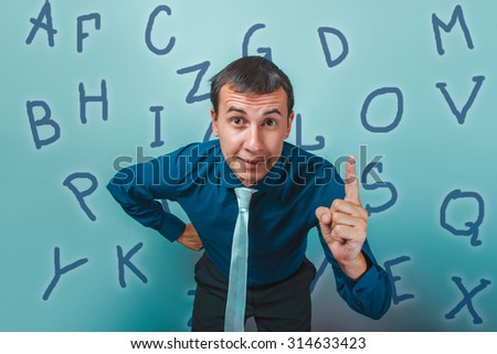 man male teacher businessman raised his finger up the alphabet letters infographics studio photo