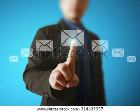 Businessman pressing virtual icons, technology concept