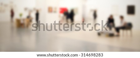 People at art gallery generic background, intentionally blurred post production.