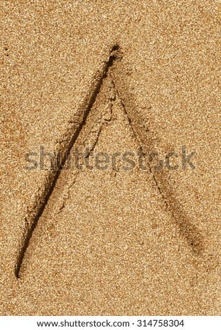 Russian alphabet written in sand