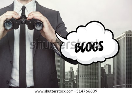 Blogs text on speech bubble with businessman holding binoculars on city background