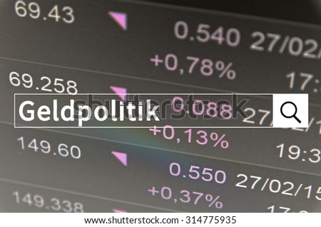 Geldpolitik written in search bar with the financial data visible in the background. Multiple exposure photo. Geldpolitik is monetary policy on Deutsch.