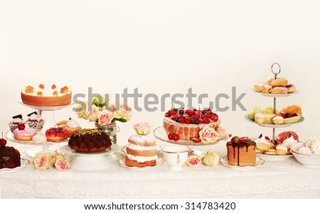 Table with loads of cupcakes and cakepops and birthday cakes Royalty-Free Stock Photo #314783420