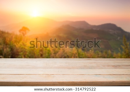 desk space and beautiful forest with mountain background for present product,vintage effect.