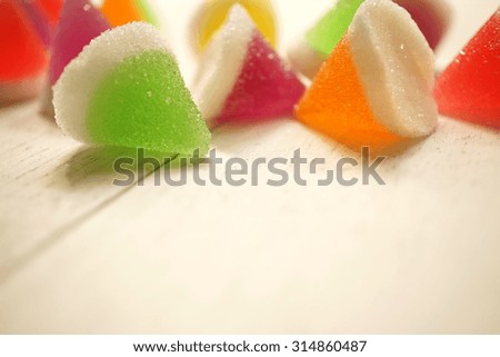 colorful jelly on white wooden table