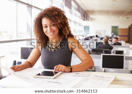Young African American female architect working in an office Royalty-Free Stock Photo #314862113