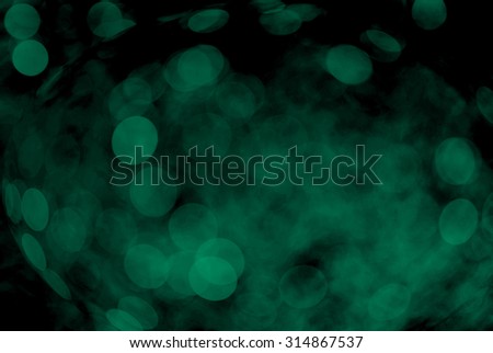 Green bokeh on a dark background