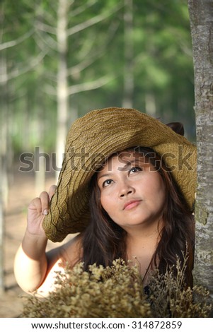 Large woman very happy in the meadow in vintage style