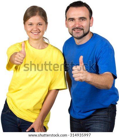 Young woman wearing yellow shirt and man wearing blue shirt holding thumb up,looking at camera,  isolated over white background