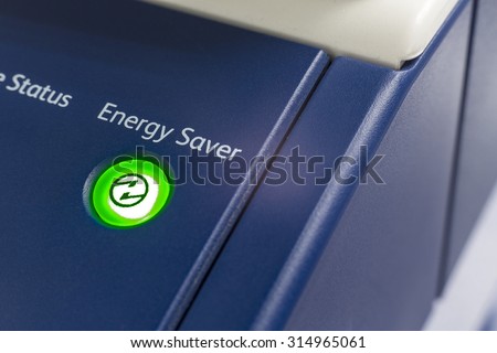 Green energy key with eco bulb light icon on printer Royalty-Free Stock Photo #314965061