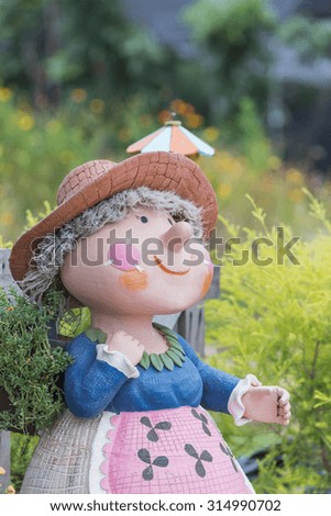 sculpture doll in garden