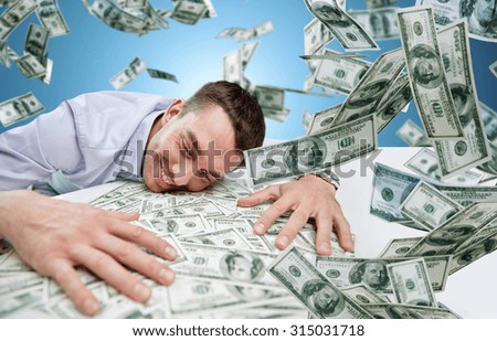 business, people, success and fortune concept - happy businessman with heap of dollar money over blue background