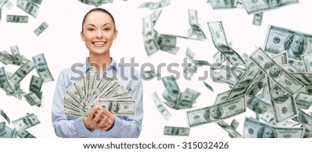 business, money, finance, people and banking concept - smiling businesswoman with heap of dollar cash money