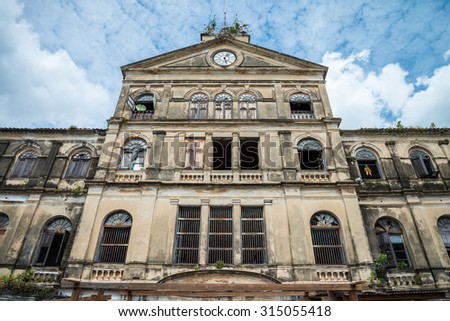 Old Bangrak historical fire station in Bangkok Thailand against blue sky Royalty-Free Stock Photo #315055418