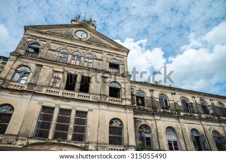 Old Bangrak historical fire station in Bangkok Thailand against blue sky Royalty-Free Stock Photo #315055490