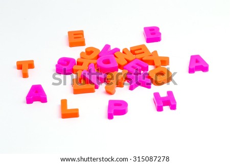 plastic alphabets shot on white background for kindergarten kids to learn basic alphabets of english language