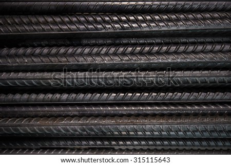 Artistic steel bars closeup, reinforcement on construction site, editable background. Steel bars or rods used on construction sites for concrete layering.