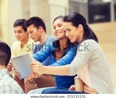 education, high school, technology and people concept - group of smiling students with tablet pc computers making photo or video indoors