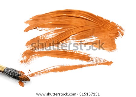 Paint brush and orange painting on white background