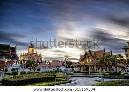 Loha Prasat Metal Palace in Wat ratchanadda, Bangkok, Thailand, clouds motion blur