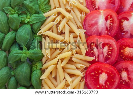 italian food with background - pasta, tomato, basil Royalty-Free Stock Photo #315163793