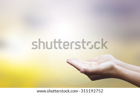 help,empty Hands with nature abstract background