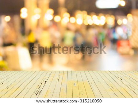 blurred background. street decorated with festive lights.