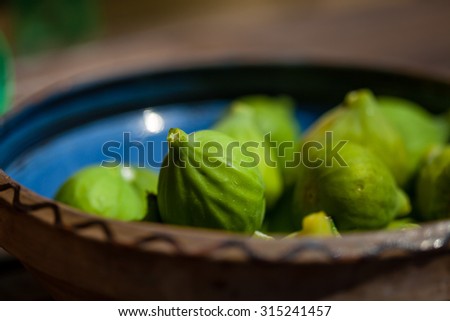 Color picture of figs in a blue painted clay pot