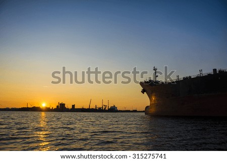 Beautiful silhouette from a big bulk carrier in port. Photo's taken during sunset.