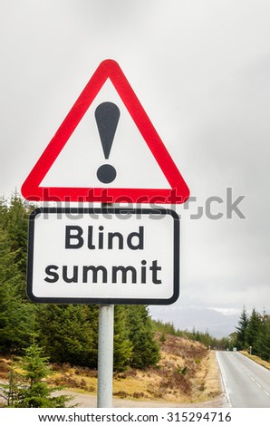 European Triangular Warning Sign on a Mountain Road