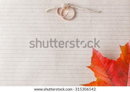 Invitation wedding card with two golden rings and place for inscription