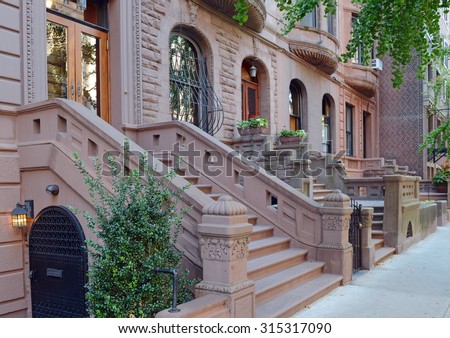 Brownstone apartment building facade, New York Royalty-Free Stock Photo #315317090