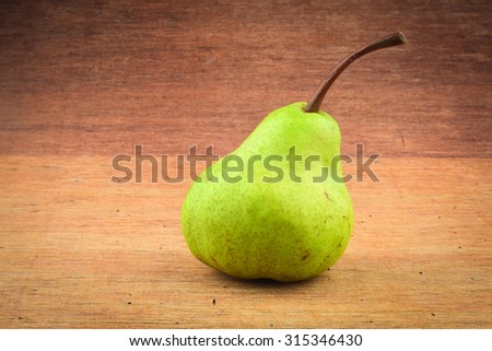 Pear on wooden background