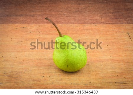 Pear on wooden background