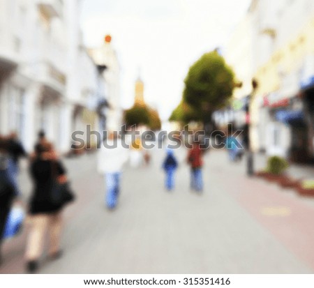 View on blured avenue with walking peoples