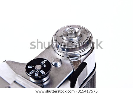 Vintage photo camera with vintage lens. Close up view part of old retro camera. Classic black manual film camera isolated on white background.