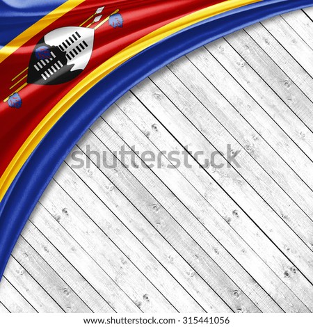 Swaziland flag   of silk with copyspace for your text or images and wood background