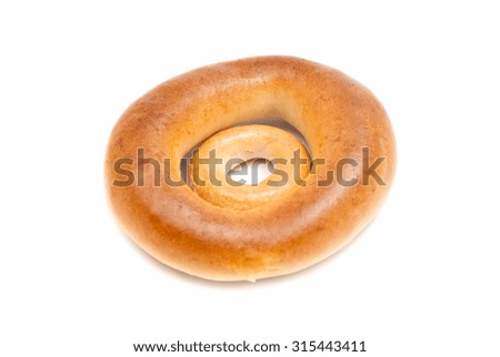 two different tasty bagels on white background 