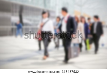 Group of business men, generic background, intentionally blurred post production.