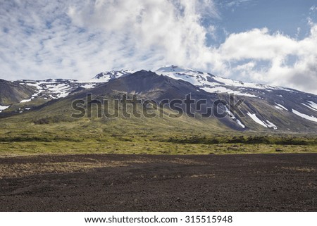 The picture shows a mountain landscape in Iceland. The mountain is the Snaefellsjokull.