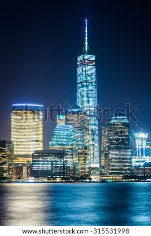 View of the Lower Manhattan skyline at night, from Exchange Place, in Jersey City, New Jersey.