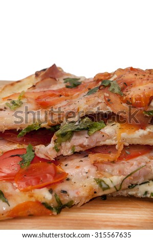 Pile of fresh pizza slices.