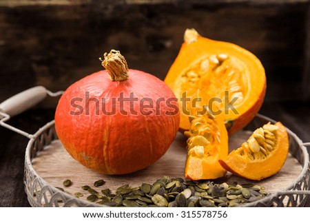Fresh sliced pumpkin with pumpkin seeds Decorated