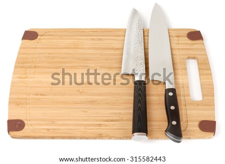 Two knives on a cutting board, white background