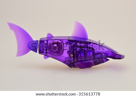 Aquabot purple mechanical fish on white background 